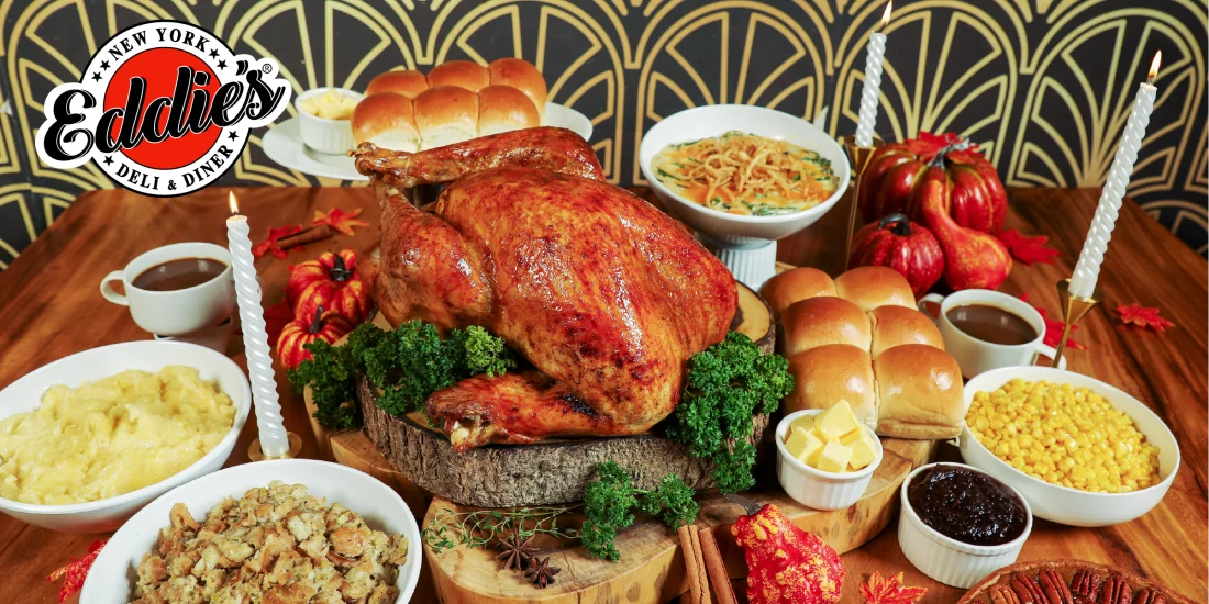 Full table of thanksgiving feast for family with roasted turkey